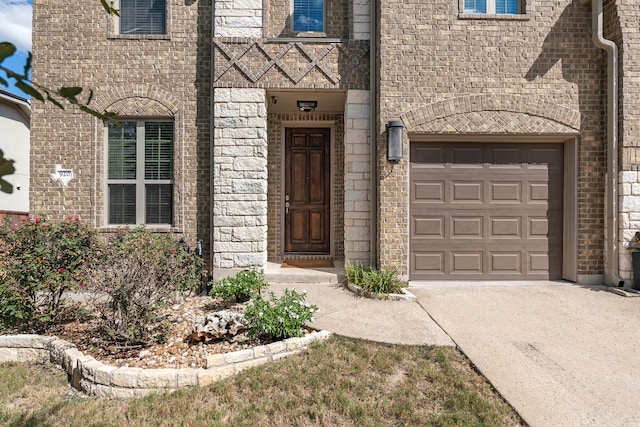 view of exterior entry featuring a garage