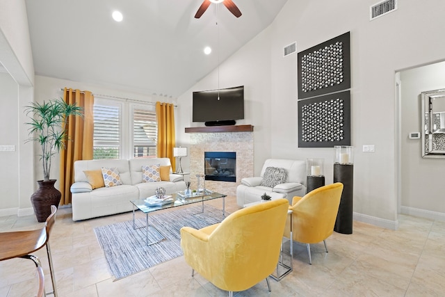 living room featuring ceiling fan and high vaulted ceiling