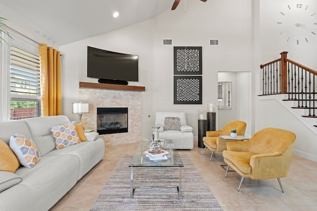 tiled living room featuring high vaulted ceiling and ceiling fan