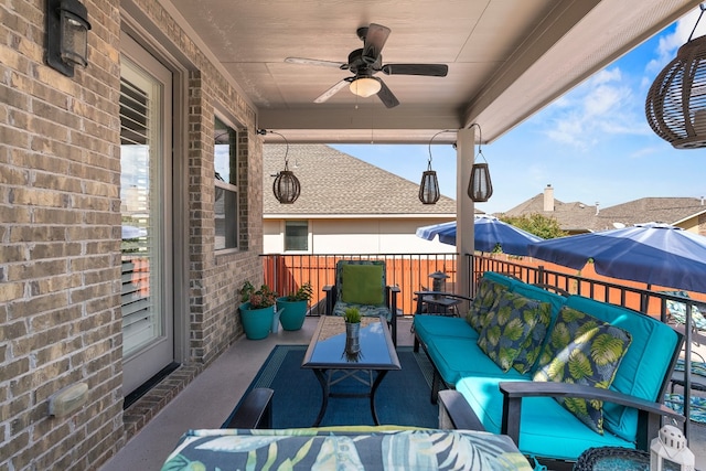 view of patio with outdoor lounge area and ceiling fan