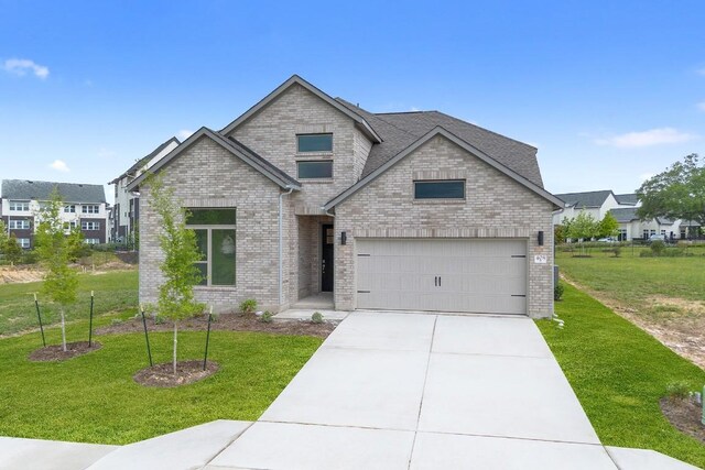 408 Ridgewell Loop, Georgetown, TX 78633 - craftsman-style home featuring brick siding, a front lawn, and concrete driveway