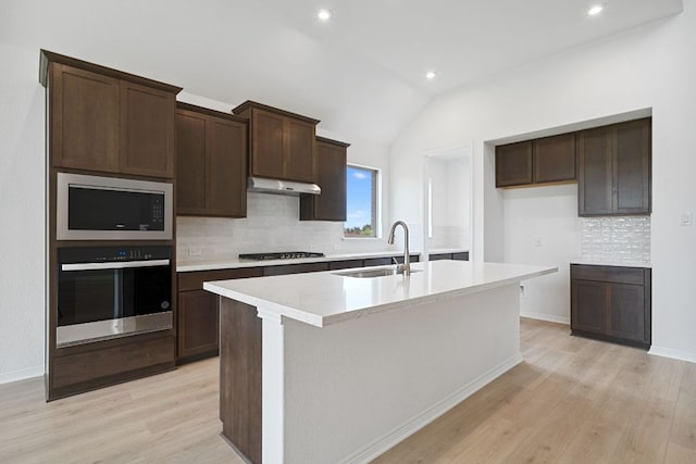 408 Ridgewell Loop, Georgetown, TX 78633 - kitchen with oven, a sink, built in microwave, gas stovetop, and light wood-type flooring