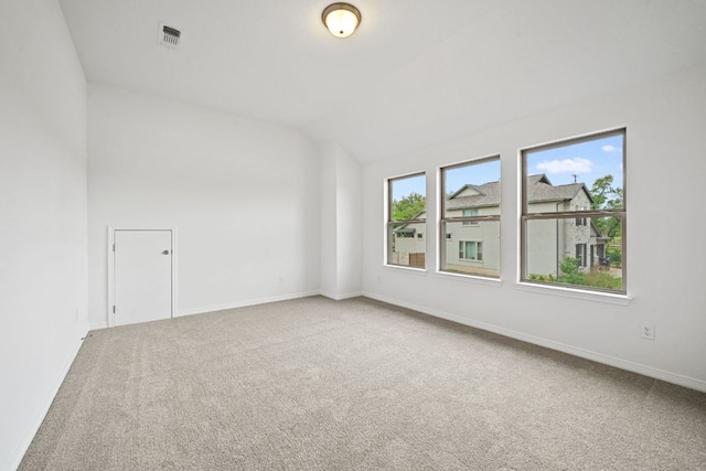 408 Ridgewell Loop, Georgetown, TX 78633 - empty room featuring carpet, lofted ceiling, and baseboards