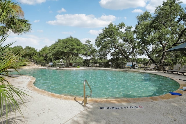 view of pool featuring a patio