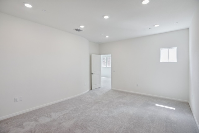 empty room with light colored carpet