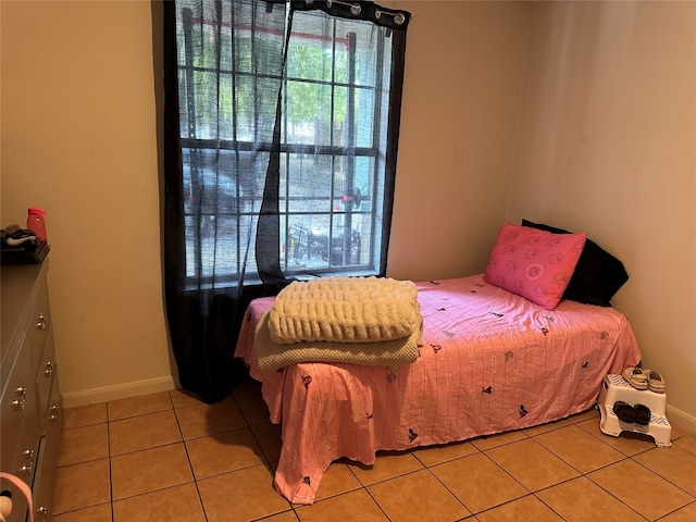 bedroom featuring light tile patterned floors