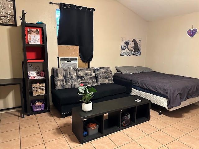 bedroom featuring cooling unit and light tile patterned flooring