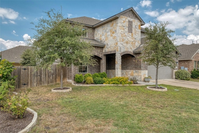 view of front of home with a front yard and a garage