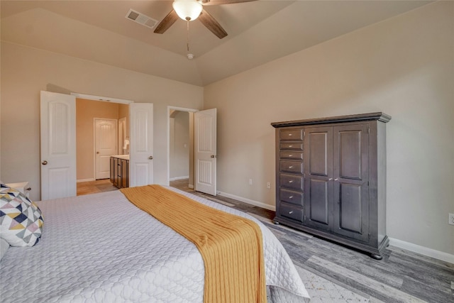 bedroom with vaulted ceiling, wood-type flooring, and ceiling fan