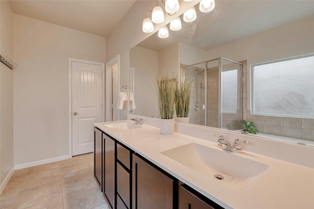 bathroom with vanity, tile patterned floors, and a shower with shower door