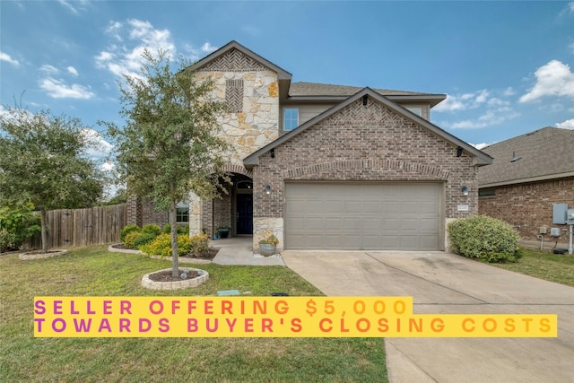 view of front property featuring a front lawn and a garage