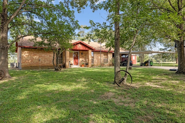 single story home with central AC unit, a front yard, and a carport