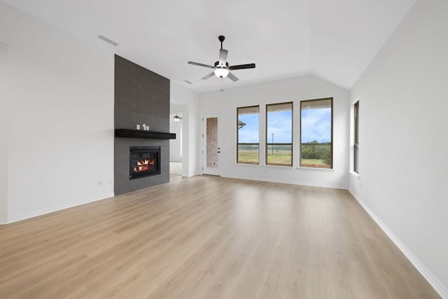 537 Raleigh Dr, Georgetown, TX 78633 - unfurnished living room with ceiling fan, light wood-style flooring, a fireplace, and lofted ceiling