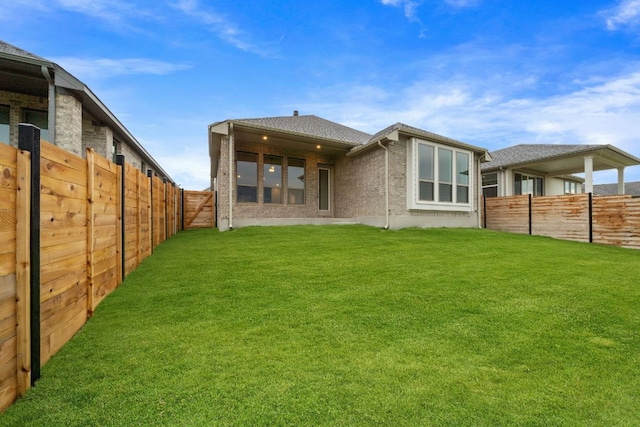 537 Raleigh Dr, Georgetown, TX 78633 - rear view of house with a fenced backyard and brick siding