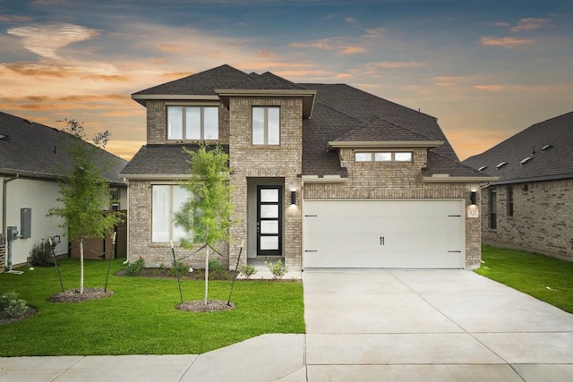 537 Raleigh Dr, Georgetown, TX 78633 - view of front of property with a shingled roof, a yard, brick siding, and concrete driveway