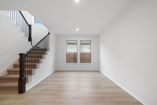 537 Raleigh Dr, Georgetown, TX 78633 - unfurnished living room featuring stairway, light wood-style floors, and recessed lighting