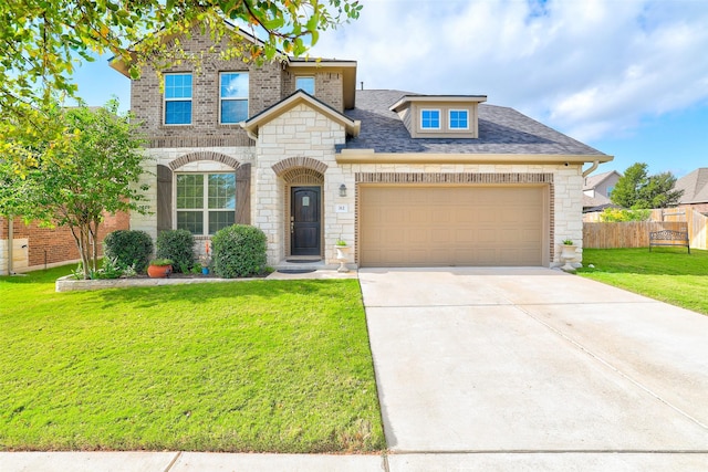 view of front of house with a front lawn and a garage