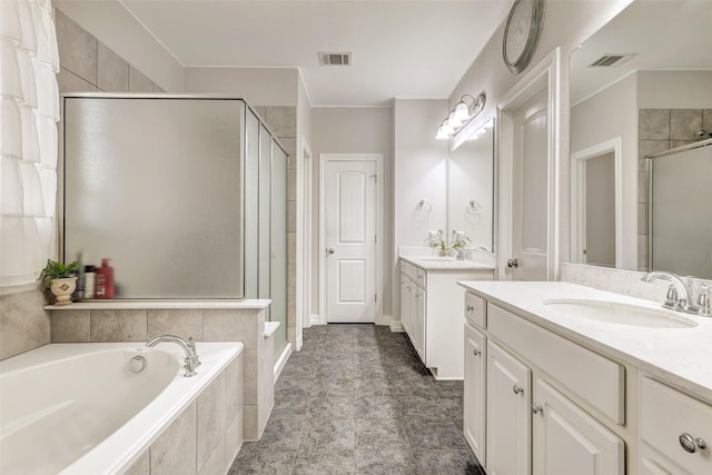 bathroom featuring separate shower and tub and vanity