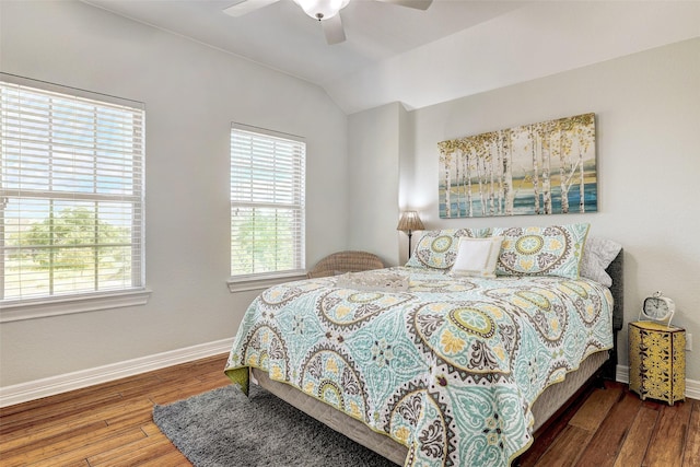 bedroom featuring ceiling fan, vaulted ceiling, and dark wood-type flooring