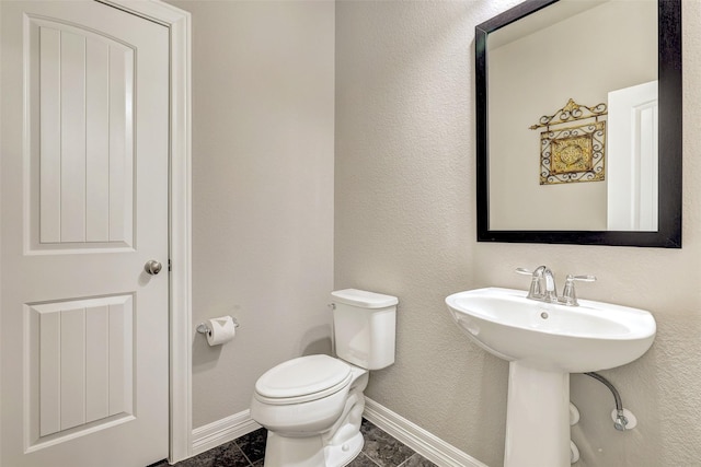 bathroom with sink and toilet