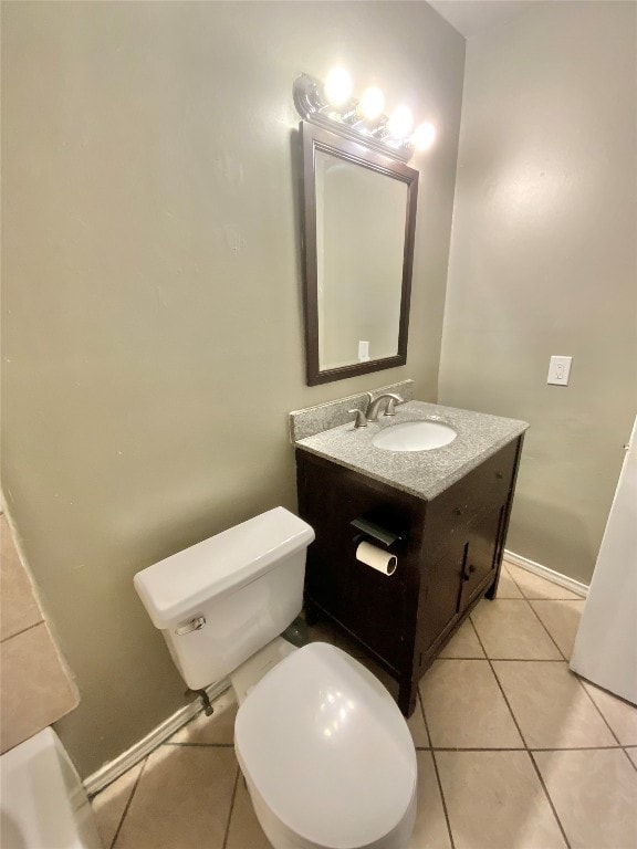 bathroom featuring tile patterned floors, vanity, and toilet