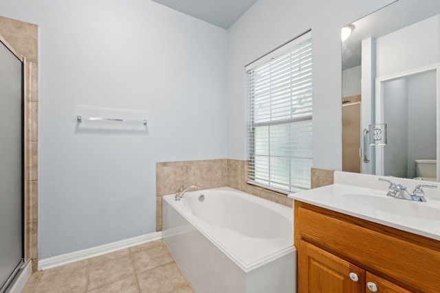 full bathroom featuring vanity, separate shower and tub, a healthy amount of sunlight, and toilet