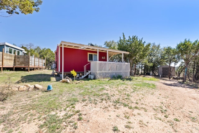 exterior space with a lawn and a deck