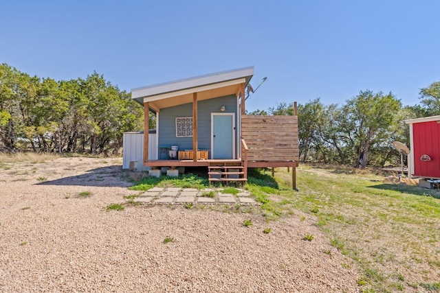 exterior space featuring a yard and a wooden deck