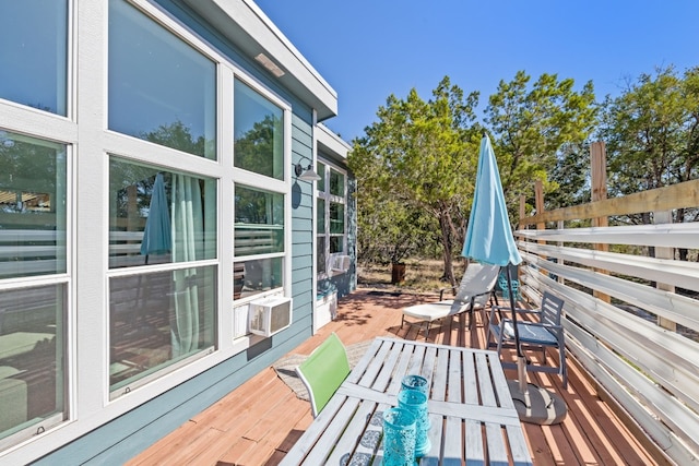 wooden terrace featuring cooling unit