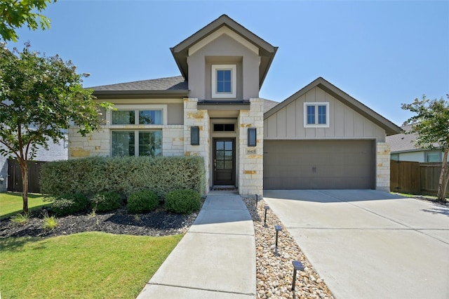 view of front facade featuring a garage and a front yard