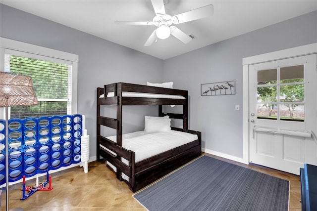 bedroom with light tile patterned flooring and ceiling fan