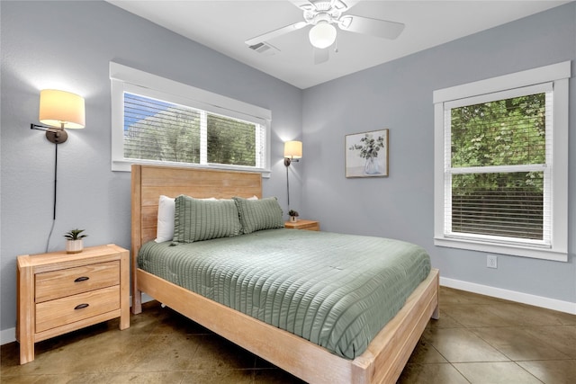 tiled bedroom with ceiling fan