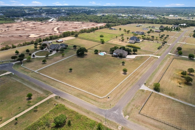 birds eye view of property featuring a rural view