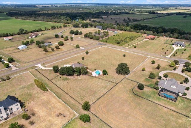 birds eye view of property with a rural view