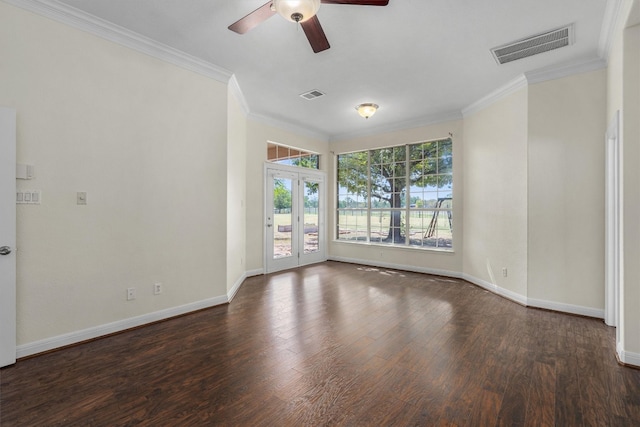 empty room with ceiling fan, french doors, dark hardwood / wood-style floors, and ornamental molding