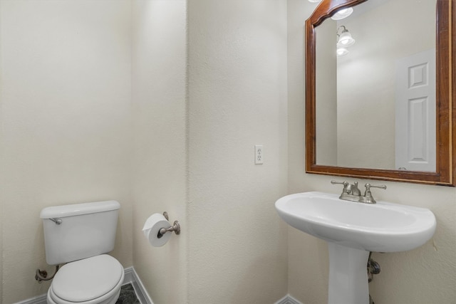 bathroom featuring toilet