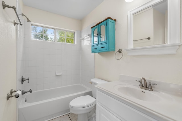 full bathroom with tile patterned floors, tiled shower / bath combo, vanity, and toilet