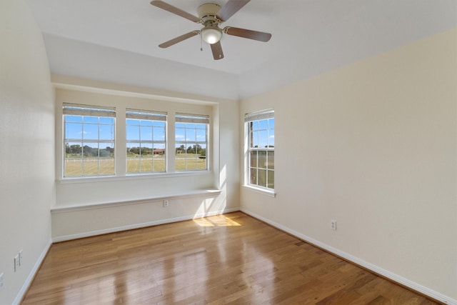 spare room with ceiling fan and light hardwood / wood-style floors