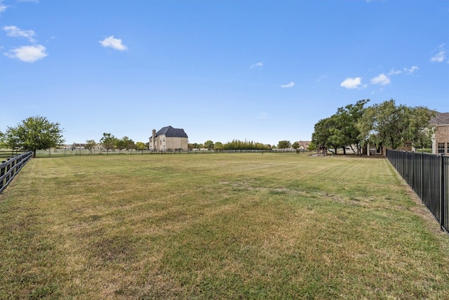 view of yard with a rural view