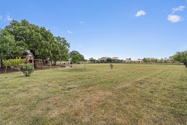 view of yard with a playground and fence