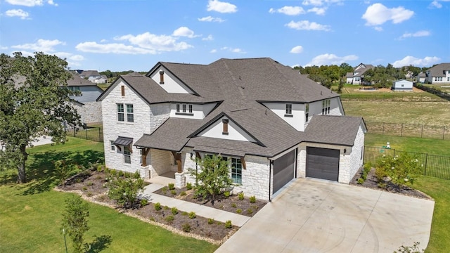 view of front of house with a garage and a front yard