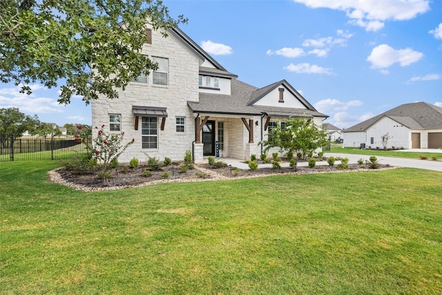 craftsman-style home featuring a front yard