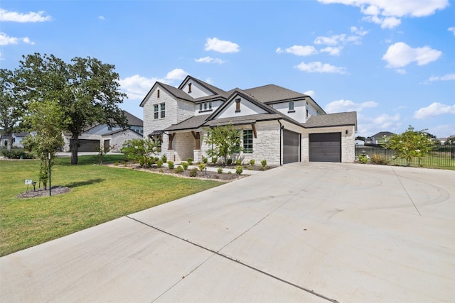 craftsman house with a garage and a front lawn