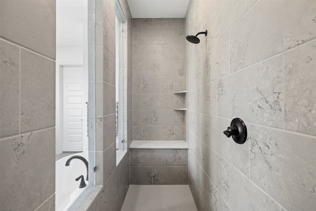 bathroom with tiled shower