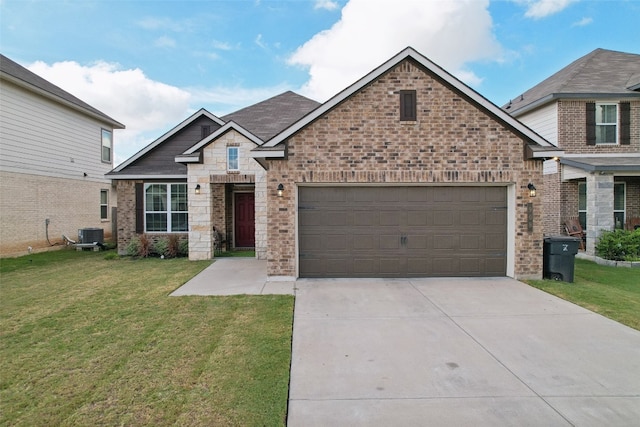 craftsman-style house featuring a garage, a front lawn, and central air condition unit