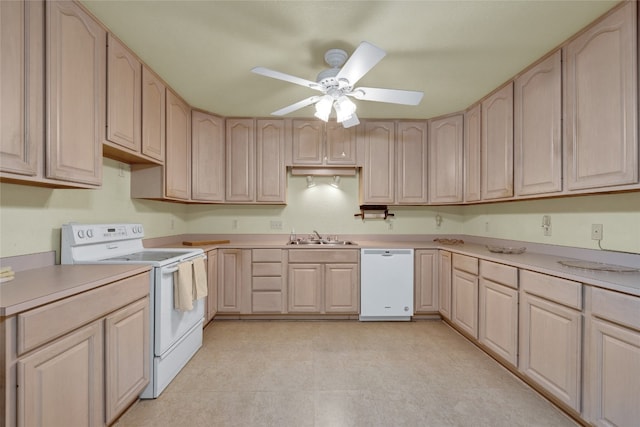 kitchen featuring sink, white appliances, light tile patterned floors, ceiling fan, and light brown cabinetry