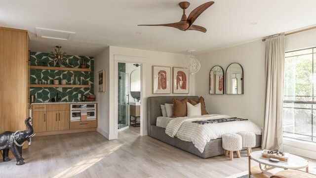 bedroom with light hardwood / wood-style flooring, multiple windows, and ceiling fan