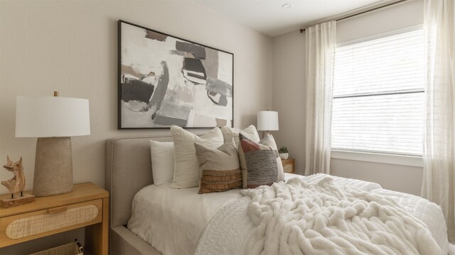 bedroom featuring multiple windows