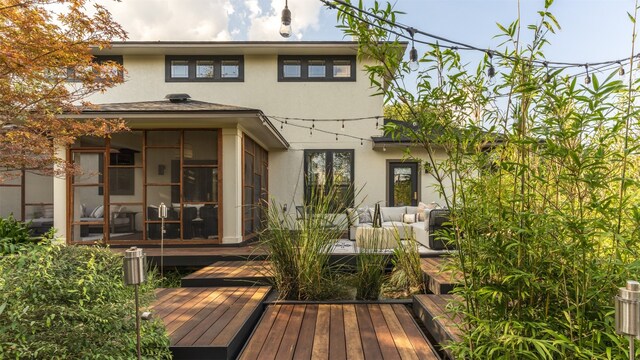 rear view of house featuring a deck