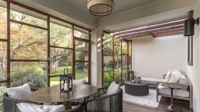 sunroom / solarium featuring plenty of natural light